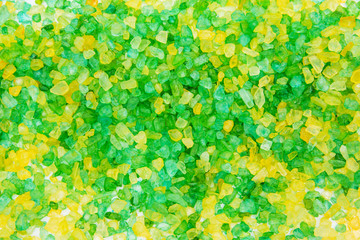 Texture of green and yellow salt for the bath. Salt background