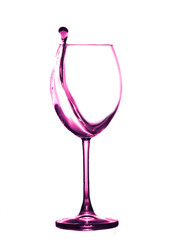 Splashing from a glass of wine on a solid background