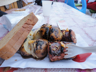 street food in winter time, grilled potato with bread and sauce