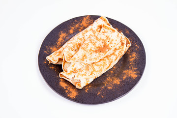 Pancakes stuffed with braised apples sprinkled with cinnamon