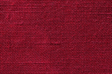 Fototapeta premium Red fabric of cloth texture background. Detail of textile material close-up.