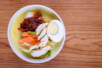 Lontong-Traditional Malaysian and   Indonesian food on wooden table .