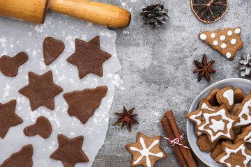 Ingredients for cooking Christmas gingerbread cookies with decorations on stone background, top view