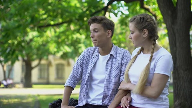 Unfaithful boyfriend looking at pretty woman passing by, girlfriend noticing it