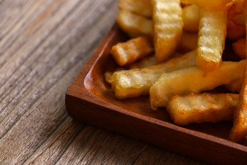 Zoom French Fries in cup on wood