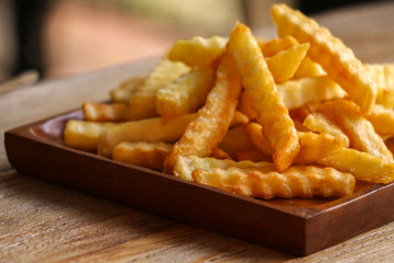 Zoom French Fries in cup on wood
