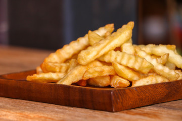 Zoom French Fries in cup on wood