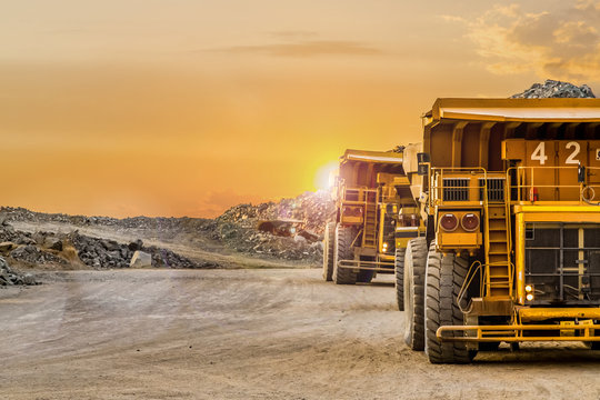 Mining dump trucks transporting Platinum ore for processing