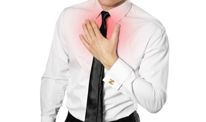 Businessman in a white shirt and tie holding his chest. Chest pain. Heartburn. Isolated on white background
