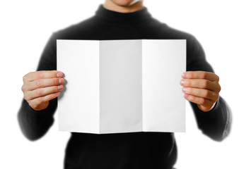 Man showing blank white flyer brochure booklet. Leaflet presentation. Pamphlet hold hands. Man show...