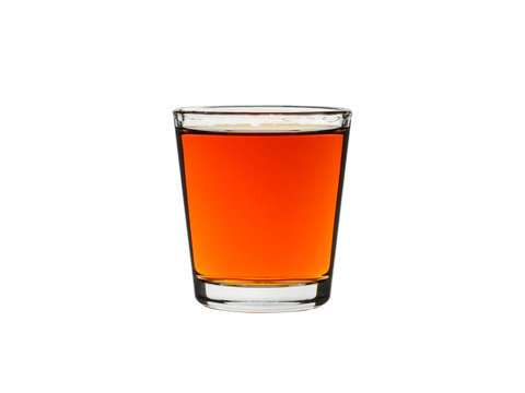 shot glass matured rum isolated on a white background