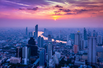 Fototapeta na wymiar Cityscape sunset aerial view from top building, Aerial view of Bangkok city in Thailand