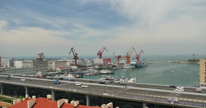 4k busy urban traffic on overpass,container terminal,QingDao china.