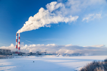 Coal processing plant. smoke of pipes pollutes atmosphere of city. Concept of oil and gas processing, pollution of environment, emissions into water resources, oncological diseases, cancer