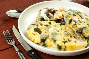 Unhealthy moldy food on a plate. Poisoned food. Dangerous lunch. Bacteria on a plate.