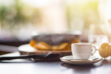 Lunch Time at Cafe. Food on table isolated cup of espresso close-up blurred background side view