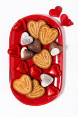 plate with cookies and candies for St. Valentine's Day, top view