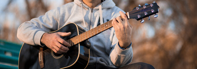 Vintage banner for site header with young man playing guitar
