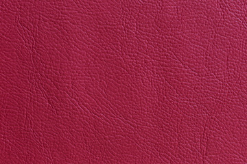 Red artificial leather texture for background and design.