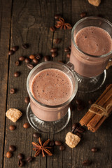 Chocolate, coffee, milk, banana shake on wooden background. Smoothie with cookies. Milkshake. Protein diet. Healthy food concept.