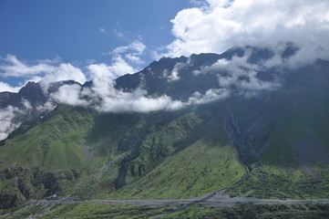 The war road in Georgia. A trail leading through the valley at the foot of Mount Kazbek to the border with Russia.