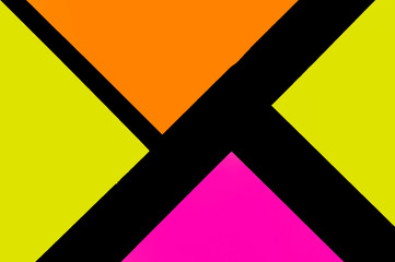 Yellow, orange and purple hue colorful office stickers on black paper. Office noteparer as...