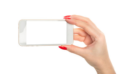 female hand holding a phone with white screen.