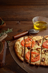 Sliced Focaccia With Caramelized Onions Tomatoes and Fresh Rosemary