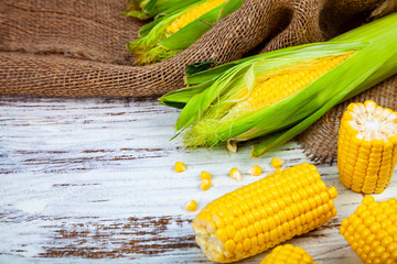 Ripe corn on a wooden table