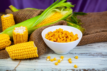 Ripe corn and  bowl with preserved corn