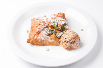 Apple strudel with vanilla ice cream and mint