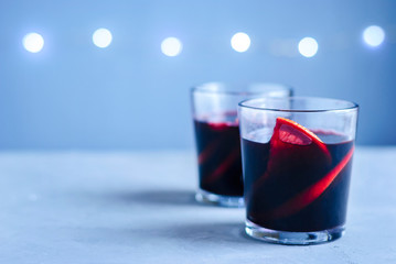 Two glasses of mulled wine with citrus