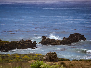 Fototapeta na wymiar waves crash on rocks in Central Coast, California