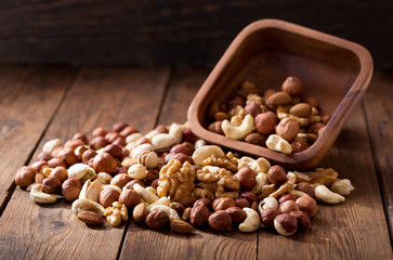 mix of nuts on wooden table
