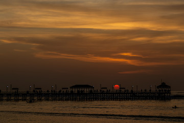 Fototapeta na wymiar sunset over the pier and sea