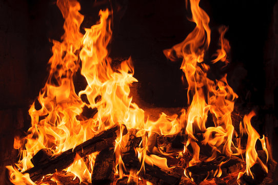 burning wood in a fireplace. Closeup view