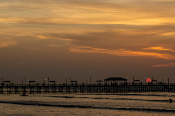 Fototapeta na wymiar sunset on the pier and sea