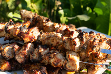 Barbecue on the grill. Ready-made pieces of meat on skewers.