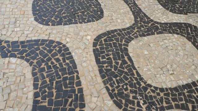 Slow motion view of famous Ipanema Beach stone sidewalk, Rio de Janeiro, Brazil