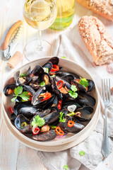 Delicious mussels with coriander and chili peppers