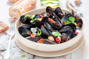 Homemade mussels served with tasty wholemeal bread