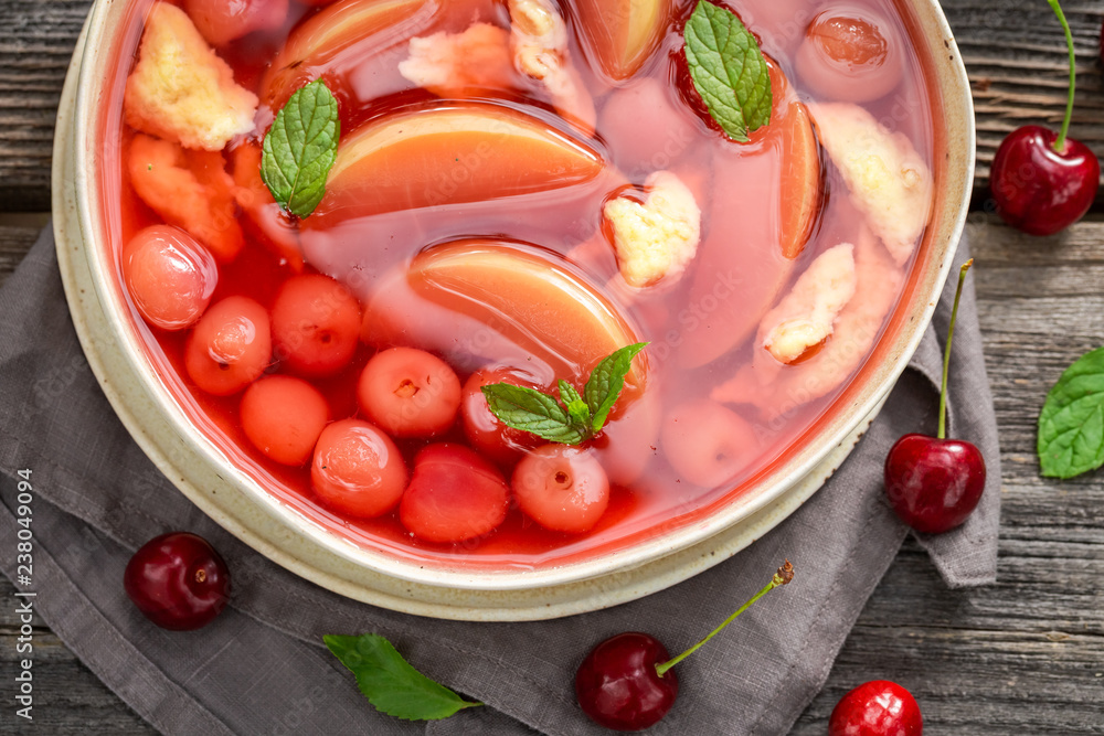 Wall mural delicious fruit soup with apples and cherries