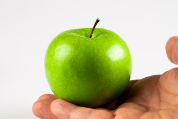 ripe green apple on black background