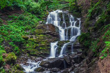 Beautiful high waterfall deep in the Carpathian mountains.