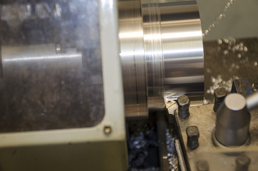 Detail of work at lathe with aluminium metal