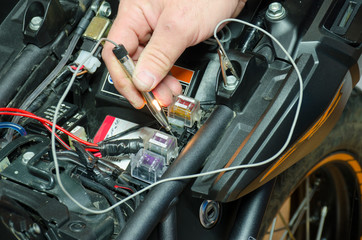 Obraz premium Detail view control voltage in motorcycle fuse box.