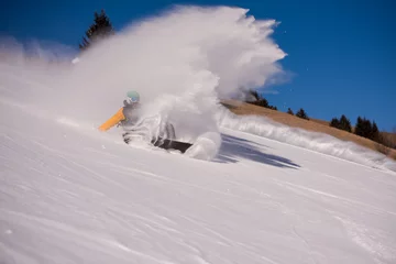 Fotobehang snowboarder crashes while carving down © .shock