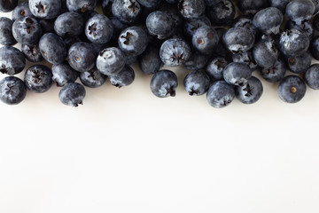 Fresh Blueberries on white wood background