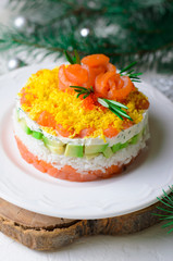 Salmon Salad, Festive Layered Salad with Salmon, Avocado, Rice and Cream Cheese Decorated with Egg Yolk and Salmon Roses, Winter Holidays Appetizer