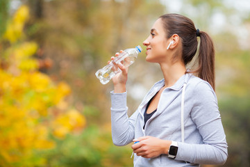 Runner drink water. Fitness, sport and healthy lifestyle concept